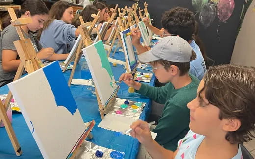 a group of children painting