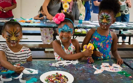 a group of children painting