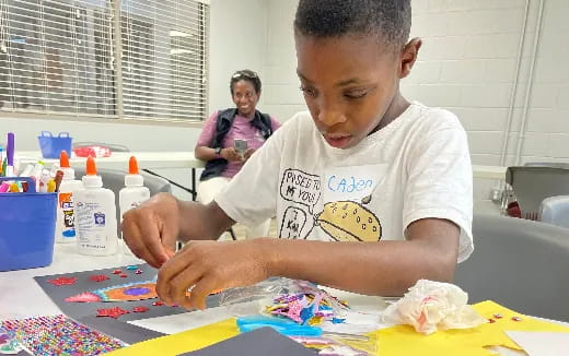 a young boy painting