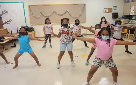 a group of children dancing