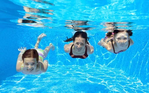 a group of people swimming