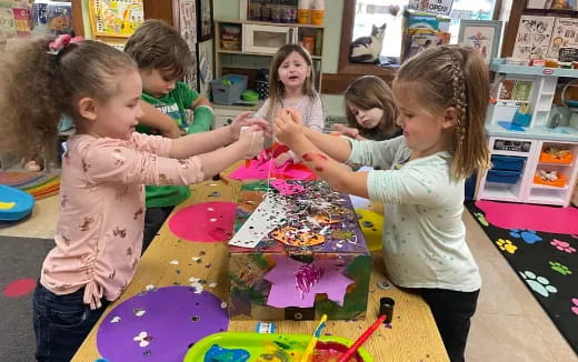 a group of children playing with toys