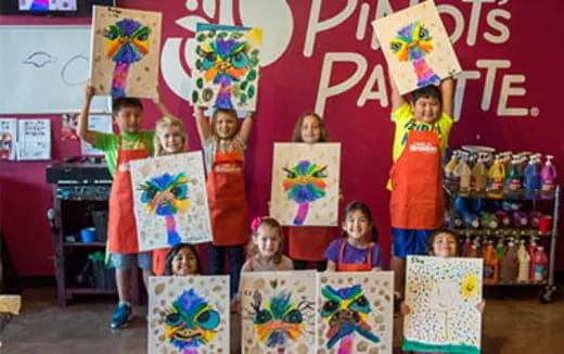 children holding up posters