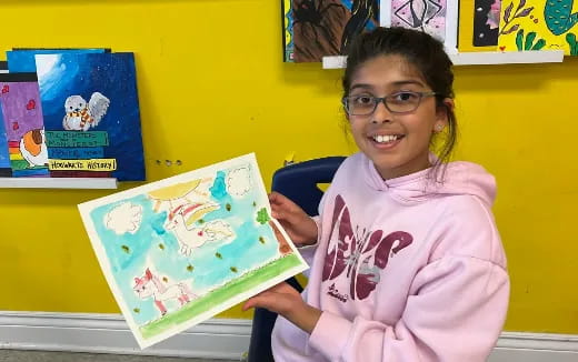 a girl holding a book