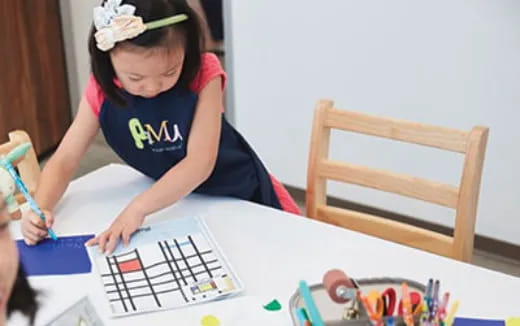 a young girl painting