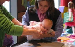 a person holding a baby