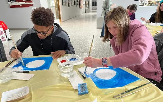 a man and a woman painting