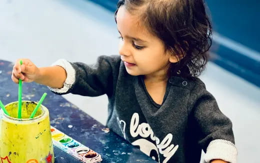 a child drinking from a straw