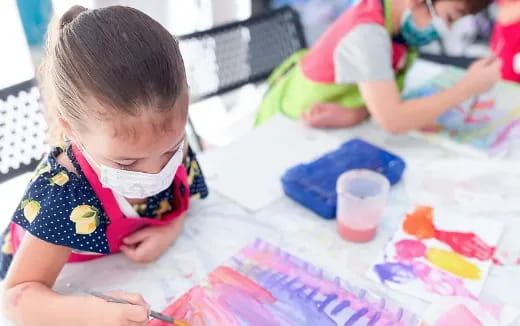 a young girl painting