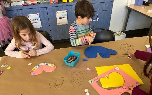 a boy and girl painting