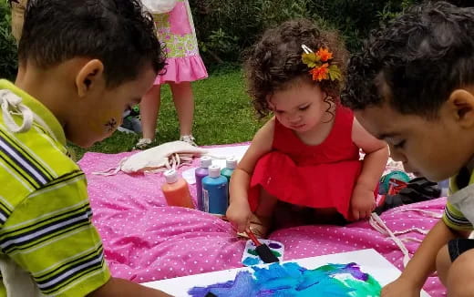 a group of children painting