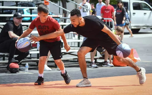 a group of men playing basketball