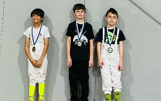 a group of boys wearing medals