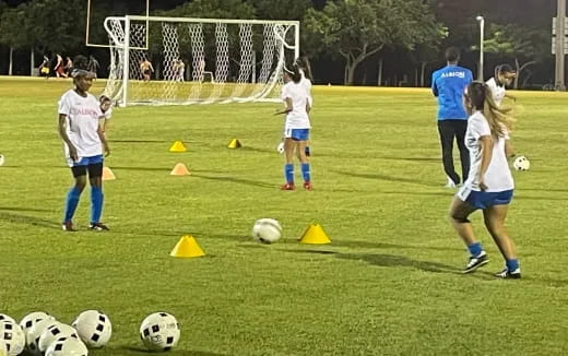 a group of girls playing football