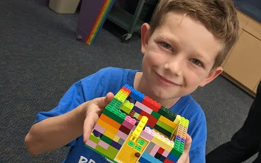 a boy holding a book