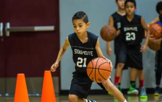 a boy playing basketball