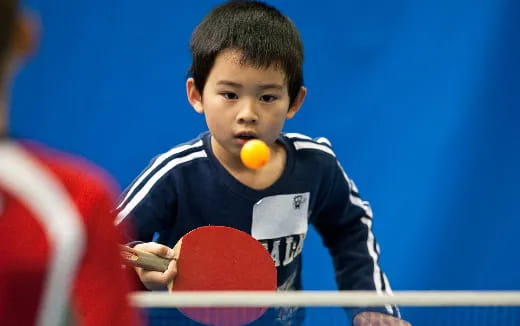 a boy holding a ball