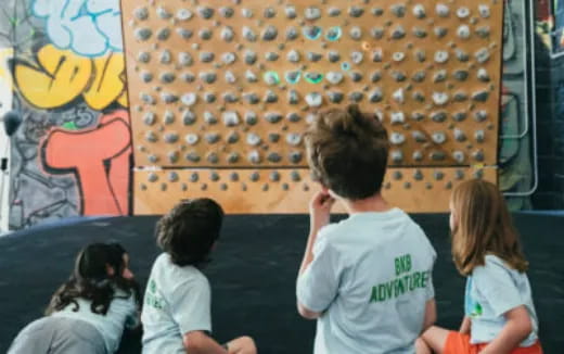 a group of children sitting in a room