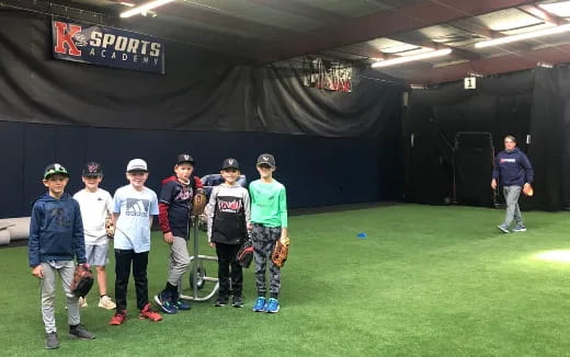 a group of people standing on a field