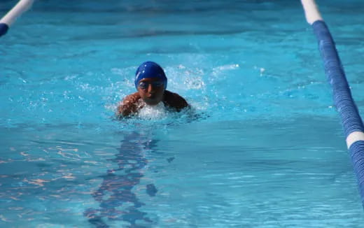 a person swimming in a pool