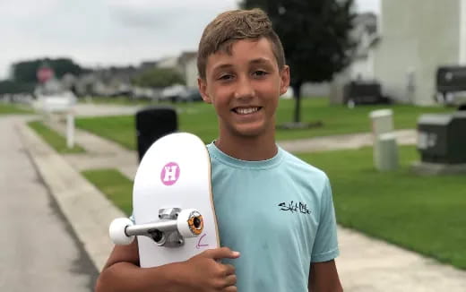 a boy holding a toy