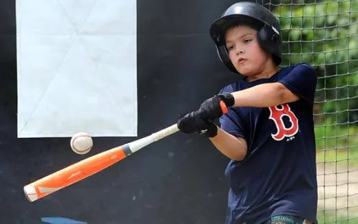 a young boy playing baseball