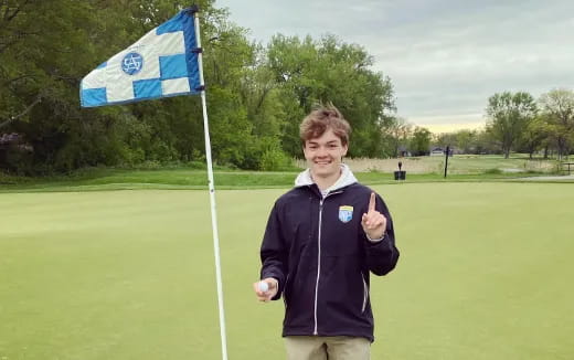 a boy holding a flag