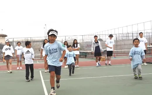 a group of people running on a track