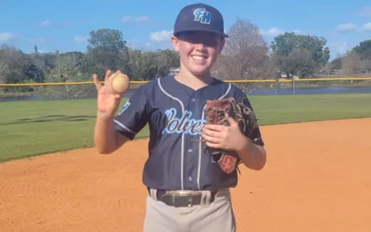 a person throwing a baseball