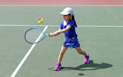 a girl playing tennis