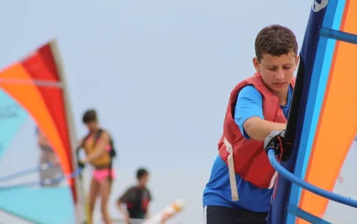 a boy holding a kite