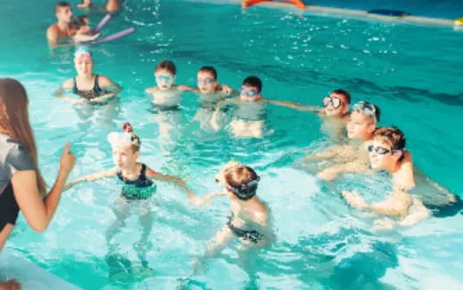 a group of people in a pool