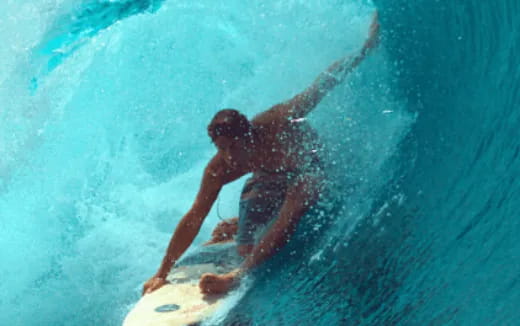 a man surfing in the sea