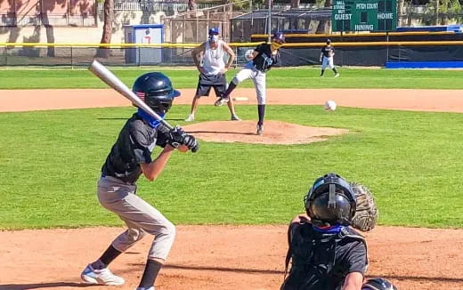 a baseball player prepares to hit a baseball
