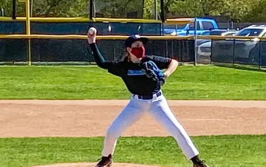 a baseball player throwing a ball