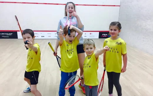 a group of kids holding bows and arrows