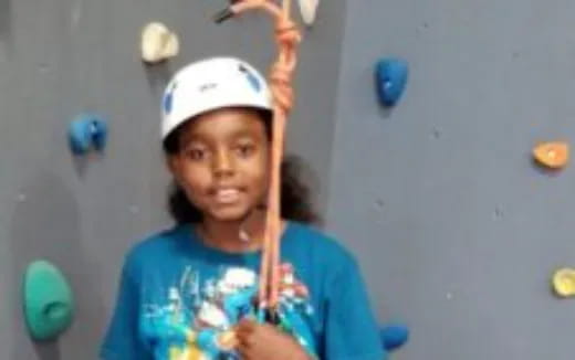 a girl holding a stick