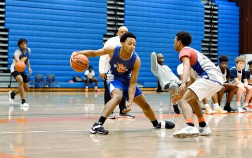 a group of men playing basketball