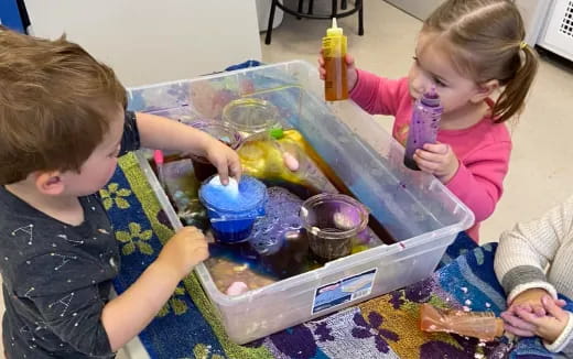 children playing with plastic containers