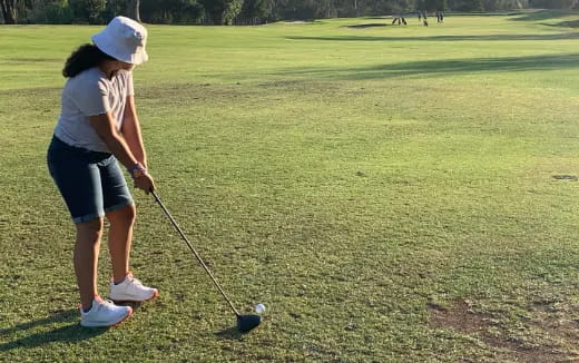 a person playing golf