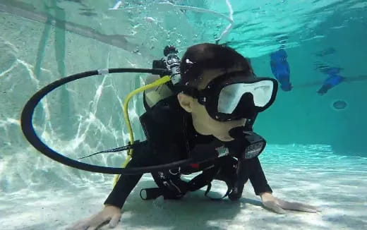 a person in scuba gear under water