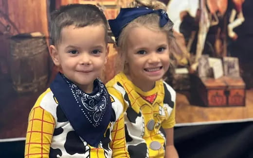 a couple of children smiling