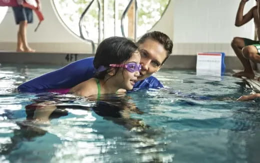 a man and a woman in a pool
