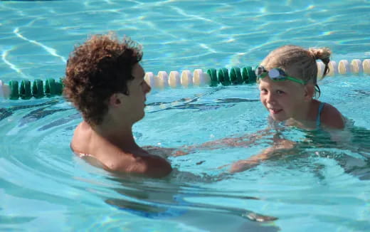 a man and woman in a pool