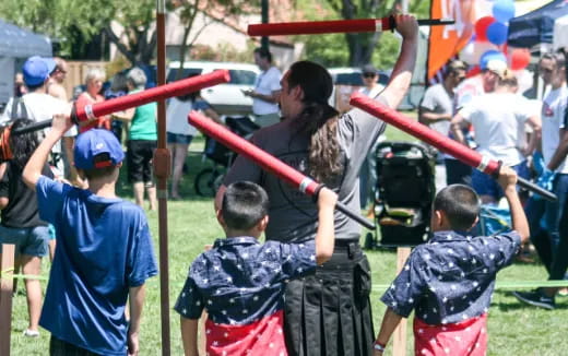a group of people holding bows and arrows