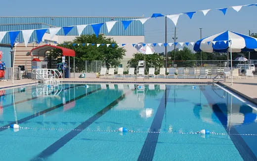 a swimming pool with umbrellas