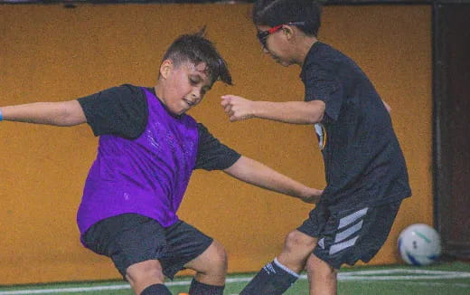 a couple of men playing football