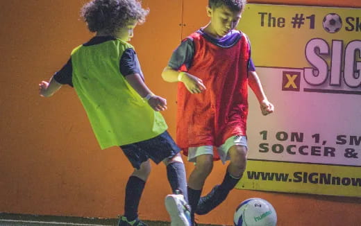 a man and a woman playing football