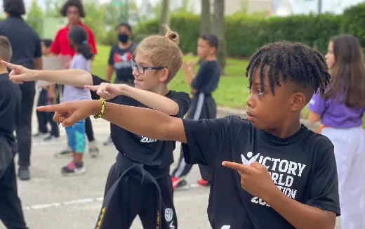 a group of kids playing with their hands
