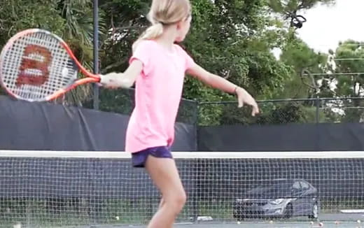 a girl playing tennis